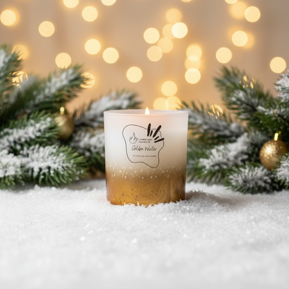 Golden Winter luxury holiday candle on snow with warm festive Christmas bokeh lights