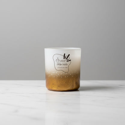 Golden Winter artisanal Christmas soy candle by Flammart with a clean minimalist background